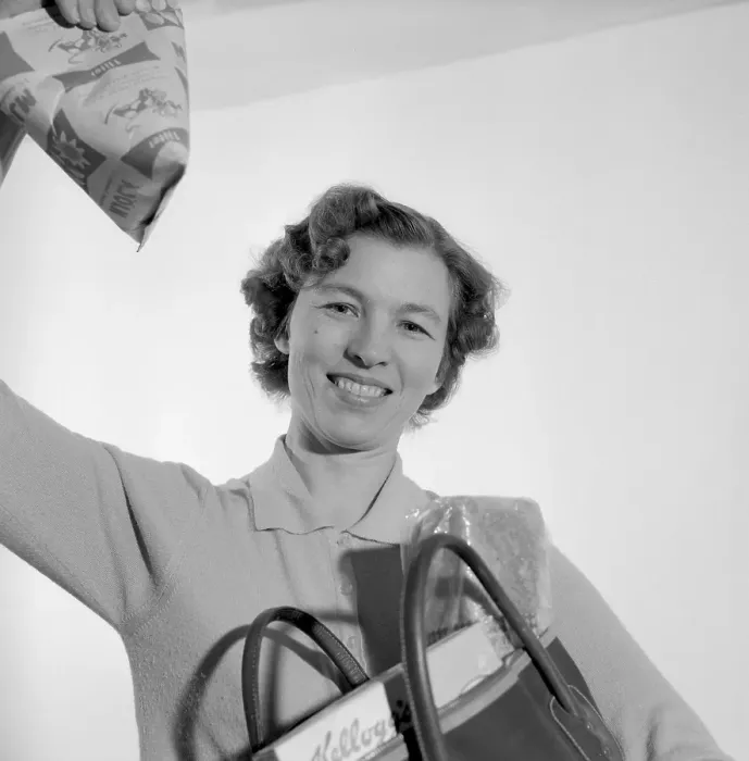 Framed Print : In the 1960s. A woman with her shopping bag Framed Print : In the 1960s. A woman with her shopping bag