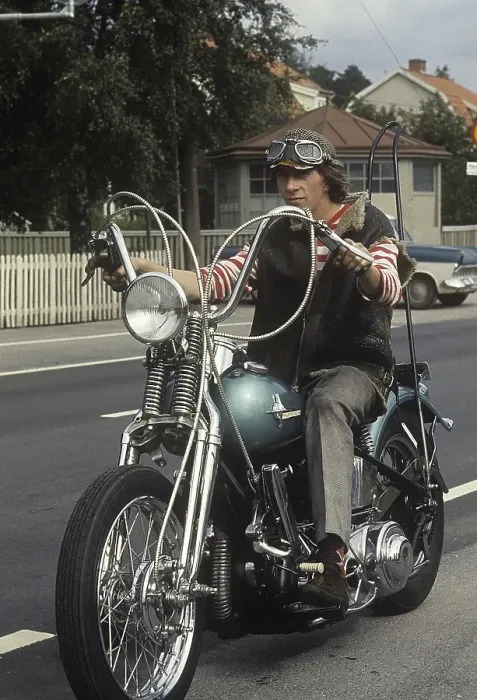 Framed Print : In the 1960s. A young man on his Harley Davidson motorcycle