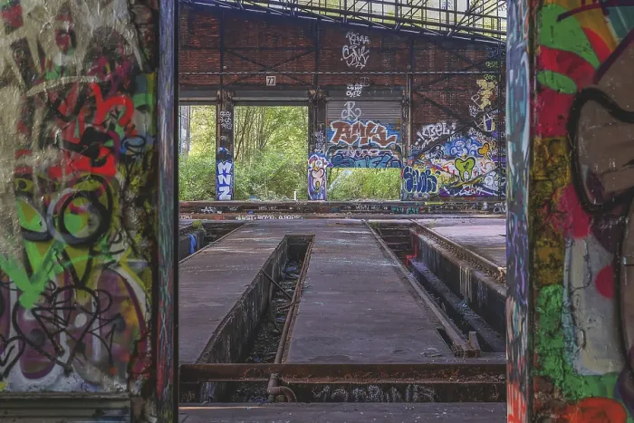 Framed Print : Abandoned hall with graffiti and view of the countryside
