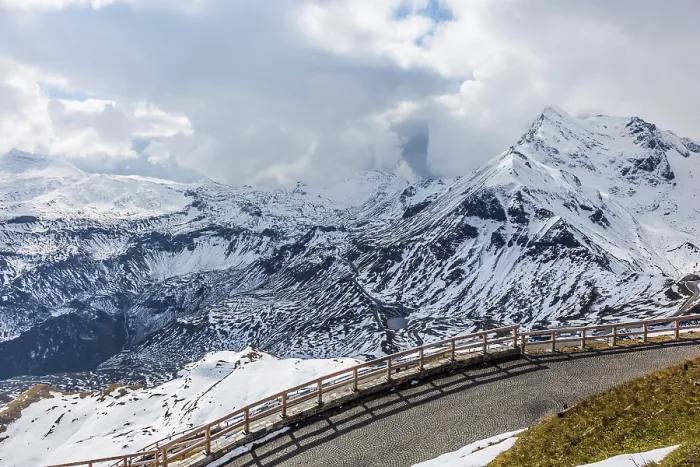 Framed Print : Abrupt turn on the wet road. The snow on the mountainside began to melt Framed Print : Abrupt turn on the wet road. The snow on the mountainside began to melt