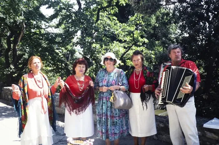 Framed Print : Accordion folk music group in front of Yalta, Crimea, Russia, 1997 Woman posing with the musicians, Europe Framed Print : Accordion folk music group in front of Yalta, Crimea, Russia, 1997 Woman posing with the musicians, Europe