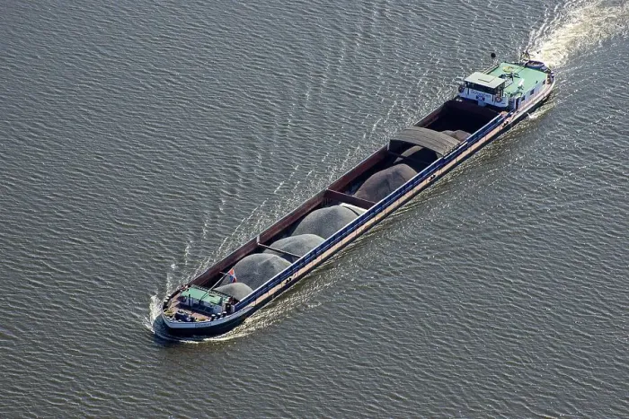 Framed Print : Aerial view of a barge Swabia with bulk material on the Elbe