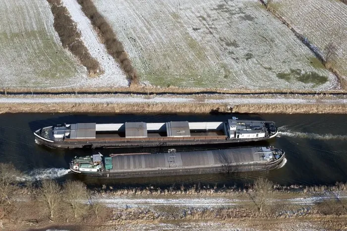 Framed Print : Aerial view of two barges in the Elbe Luebeck Canal in winter Framed Print : Aerial view of two barges in the Elbe Luebeck Canal in winter