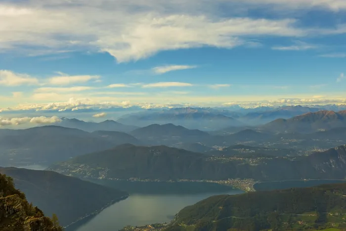 Framed Print : Aerial View over Beautiful Mountainscape with Clouds and Lake Lugano in a Sunny Day From Monte Generoso Framed Print : Aerial View over Beautiful Mountainscape with Clouds and Lake Lugano in a Sunny Day From Monte Generoso