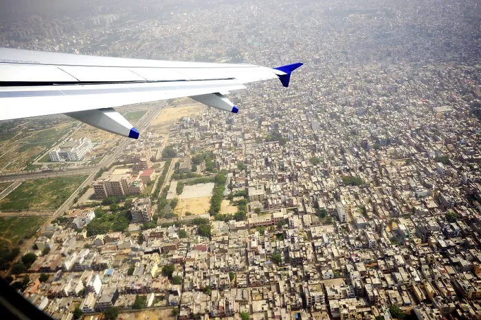 Framed Print : Aerial view of city and aircraft wing Framed Print : Aerial view of city and aircraft wing