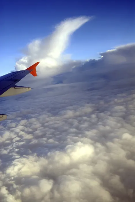Framed Print : Aerial view of clouds and aircraft wing