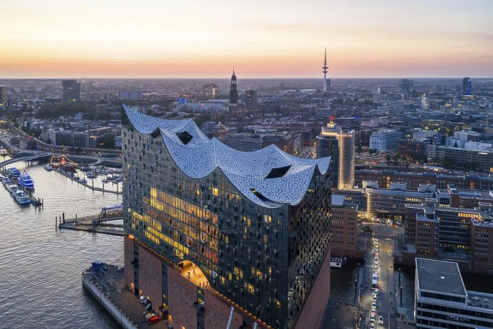 Framed Print : Aerial view of the Elbphilharmonie at sunset with illuminated windows and view over Hamburg Framed Print : Aerial view of the Elbphilharmonie at sunset with illuminated windows and view over Hamburg