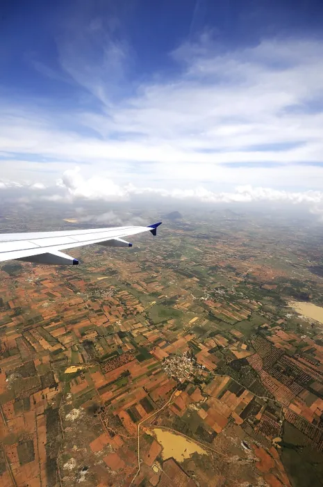 Framed Print : Aerial view of field and aircraft wing