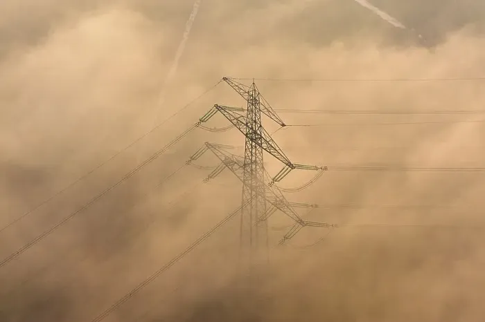 Framed Print : Aerial view of a high-voltage pylon in the fog