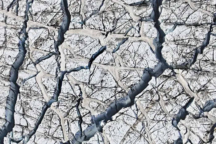 Framed Print : Aerial view, ice crevices and structures of volcanic ash and black lava in the ice and snow of the Vatnajoekull glacier Framed Print : Aerial view, ice crevices and structures of volcanic ash and black lava in the ice and snow of the Vatnajoekull glacier