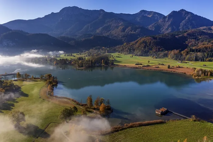 Framed Print : Aerial view of a lake in front of mountains in autumn