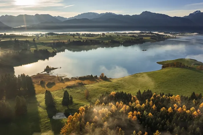 Framed Print : Aerial view of a lake in front of mountains in the morning light