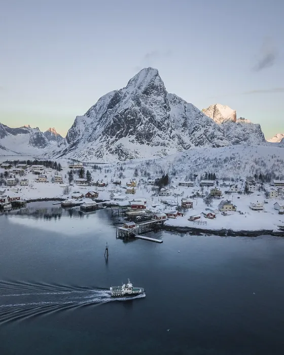 Framed Print : Aerial view of Reine with snow-covered mountains in winter Framed Print : Aerial view of Reine with snow-covered mountains in winter