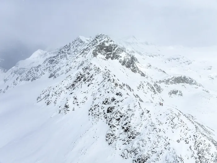 Framed Print : Aerial view, Snowy mountain landscape in fog