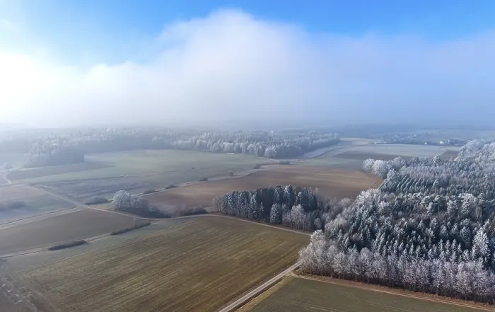 Framed Print : Aerial view of a winter landscape covered in clouds of fog