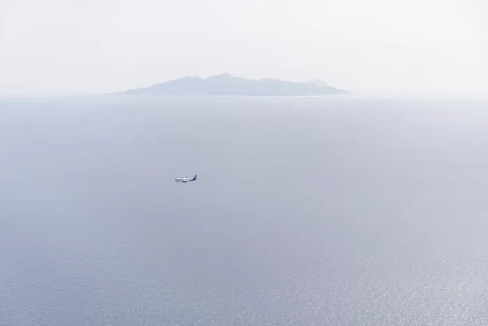 Framed Print : Aeroplane on landing approach, view of the island of Anafi