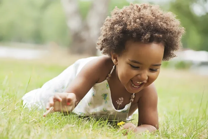 Framed Print : African young girl is having fun outside Framed Print : African young girl is having fun outside