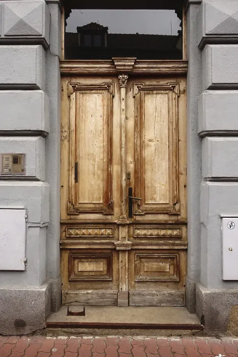 Framed Print : An aged wooden door with a rustic texture and historic architectural design