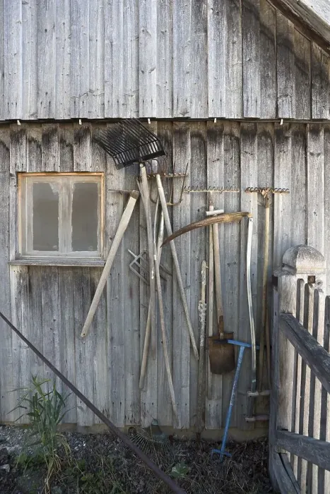 Framed Print : Agriculture implements on a barn