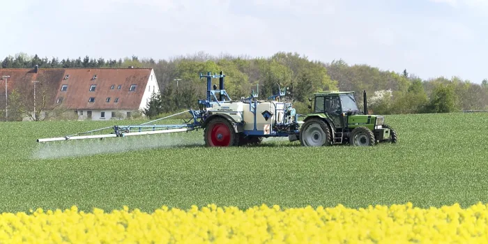 Framed Print : Agriculture, pesticide being sprayed on a field in spring