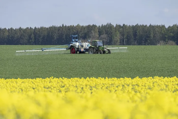 Framed Print : Agriculture, pesticide being sprayed on a field in spring