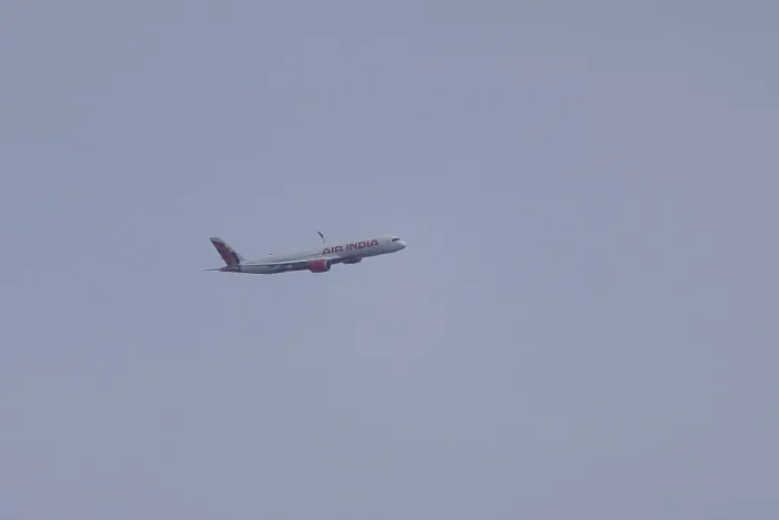 Framed Print : Aircraft of Air India airways in flight in a blue sky