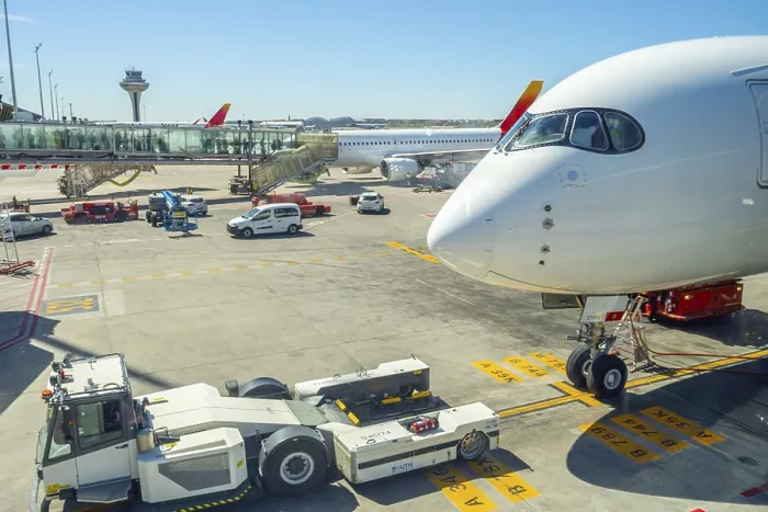 Framed Print : Airplane parked at an airport gate