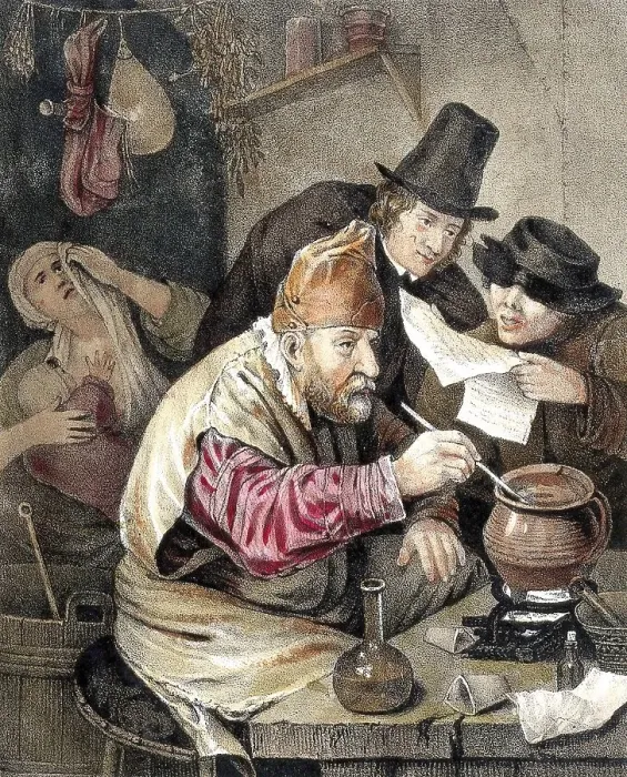 Framed Print : An alchemist bent over his crucible