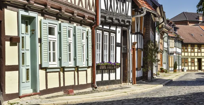 Framed Print : Alley with half-timbered houses and cobblestones