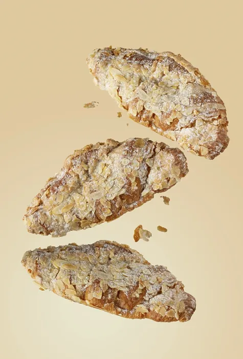 Framed Print : Almond croissants with crumbs on yellow background