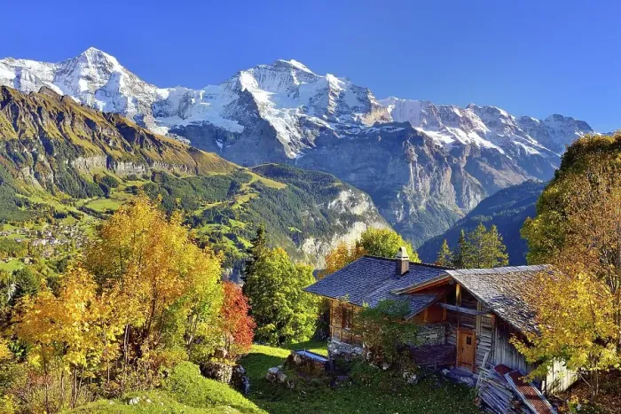 Framed Print : Alpine hut with autumn-coloured deciduous trees
