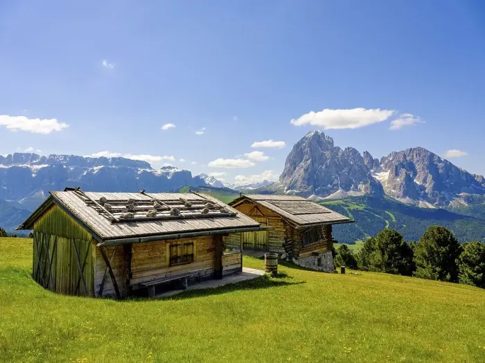 Framed Print : Alpine huts, Sella Group and Sassolungo in the background