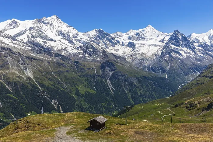 Framed Print : Alpine meadows and mountain hut at the summit of Corne de Sorebois