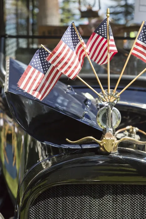 Framed Print : American flags on hood ornament of classic vintage car Framed Print : American flags on hood ornament of classic vintage car