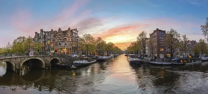 Framed Print : Amsterdam Netherlands, sunset panorama city skyline at canal waterfront