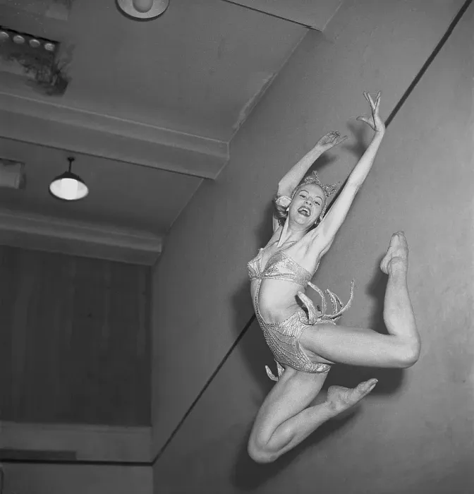 Framed Print : Amy Aaroee. Swedish actress and dancer (1925-2024) Here in her stage costume as she jumps high into the air and is caught in the hundredth of a second when she looks her best. 1947. Kristoffersson ref AA26-7