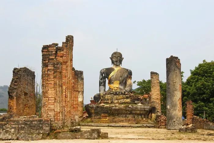 Framed Print : Ancient buddha statue and columns of the buddhist temple of Wat Phia Wat destroyed in the Vietnam war Framed Print : Ancient buddha statue and columns of the buddhist temple of Wat Phia Wat destroyed in the Vietnam war
