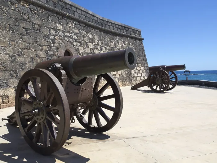 Framed Print : Two ancient cannons next to a fortress with a view of the sea Framed Print : Two ancient cannons next to a fortress with a view of the sea