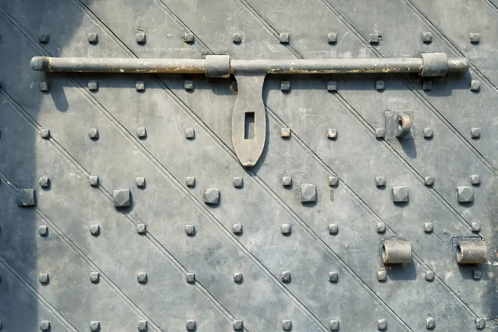 Framed Print : Ancient door fragment of Fort Canning Gate in Singapore with rough heavy bar lock