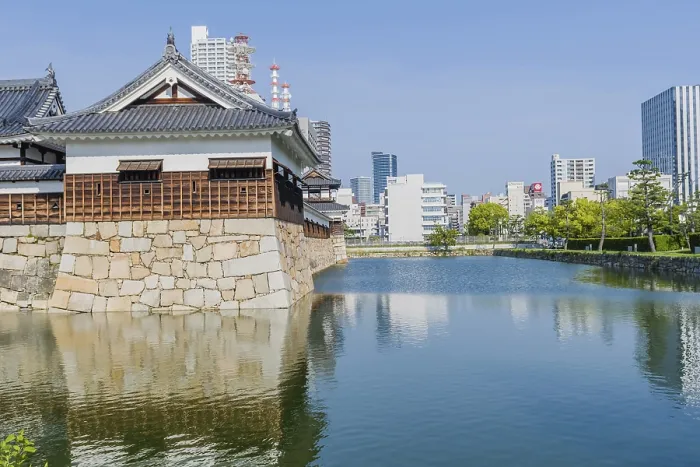 Framed Print : Ancient Hiroshima palace and mote with city buildings in background in Hiroshima