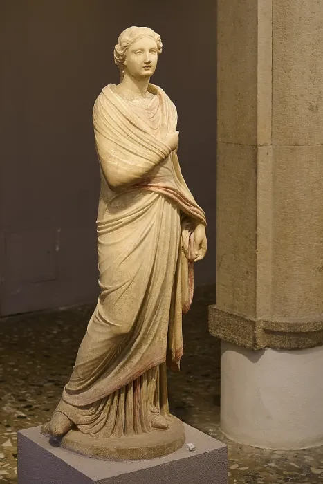 Framed Print : Ancient marble sculpture of a classical woman in a draped robe in the museum