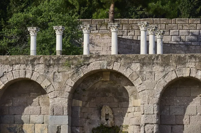 Framed Print : Ancient stone structure with columns and overgrown trees in the background Framed Print : Ancient stone structure with columns and overgrown trees in the background