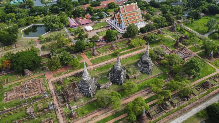 Framed Print : An ancient temple complex next to a city and a modern temple