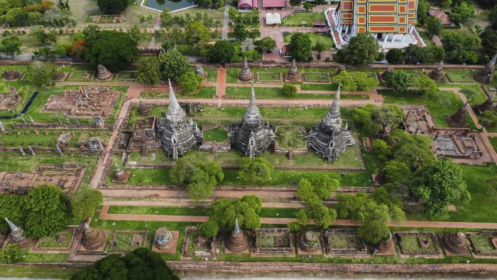 Framed Print : An ancient temple complex next to a city and a modern temple