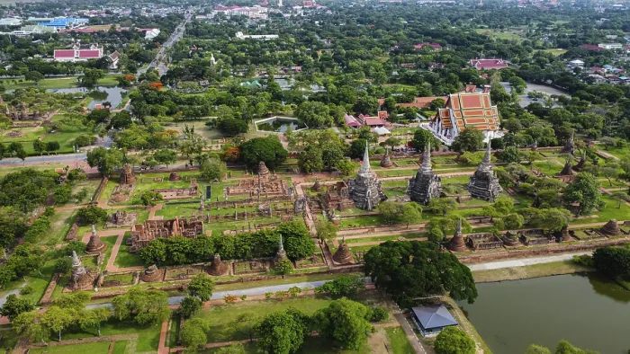Framed Print : An ancient temple complex next to a city and a modern temple