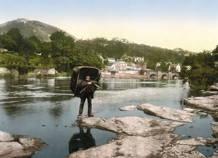 Framed Print : Angler with rain shelter, Llangollen