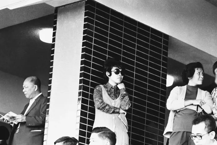 Framed Print : Anxious standing people at race course Hong Kong 1971