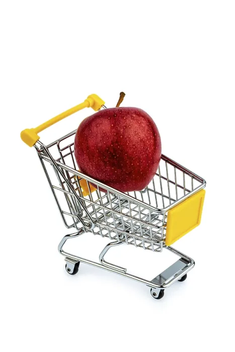 Framed Print : An apple lies in a shopping trolley