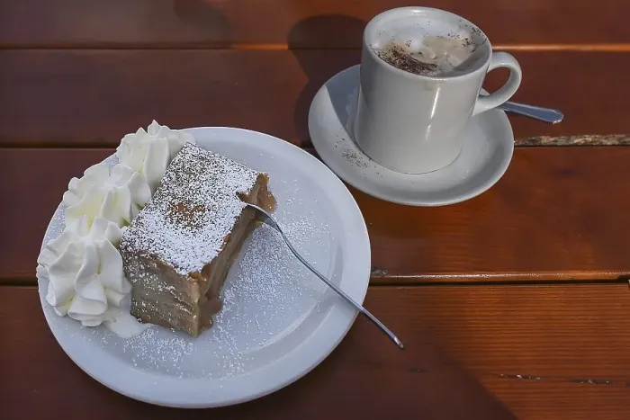 Framed Print : Apple strudel with cream and a cup of cappuccino served in a cafe Framed Print : Apple strudel with cream and a cup of cappuccino served in a cafe