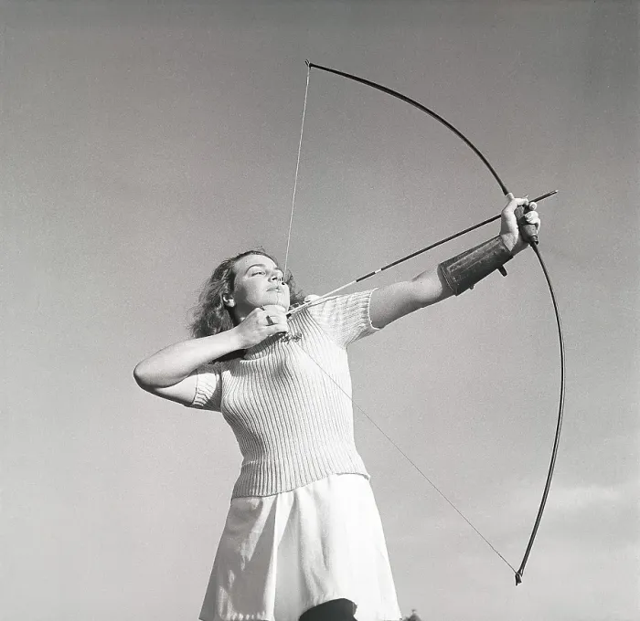 Framed Print : Archery in the 1940s. The young swedish actress Mimi Nelson with a bow and arrow